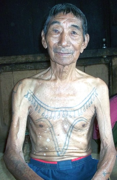 Throngkiuba, the legendary head hunter with his warrior tattoos.